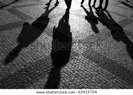 stock photo : Shadows of people walking in a street of the city, Prague,