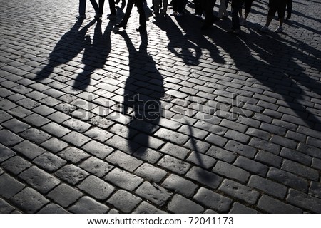 stock photo : Shadows of people walking in a street of the city, Prague