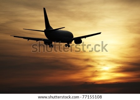 Airplane landing at sunset, Prague Ruzyne Airport