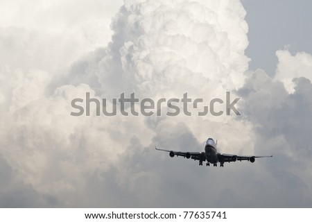Cumulonimbus. Airplane is landing from storm clouds.