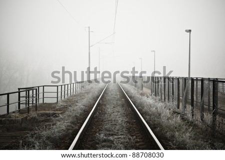 The railway in mystery fog - high contrast