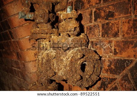 Rusty sewer valve - underground old sewage treatment plant in Prague.