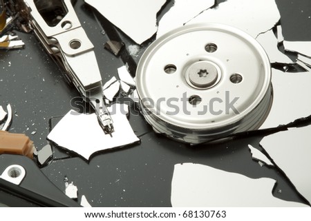 Broken - destroyed hard drive disk, macro focused on read write head