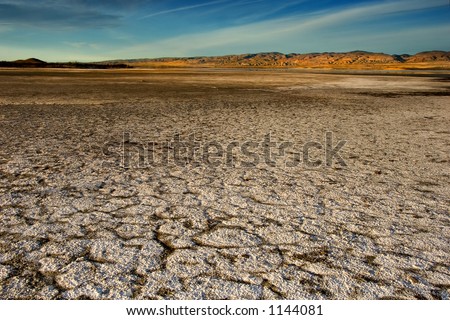 Wide angle vista of a dry lake bed in the California desert.