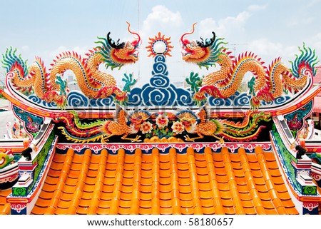 Chinese style twin dragon sculpture in the roof top, Chonburi Thailand