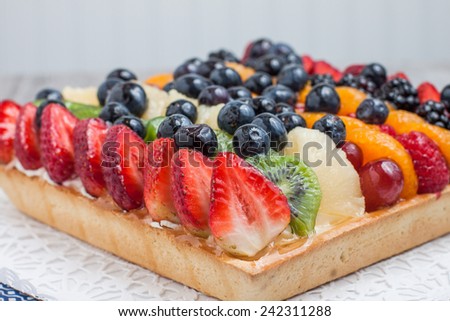 Freshly baked fruit tart with berries and fresh fruit