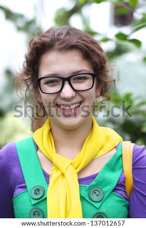 Smiling girl with rainbow clothes