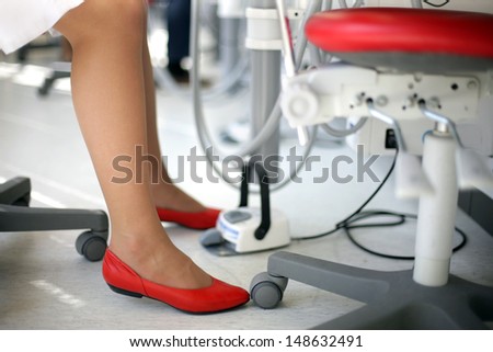 Dental student with red shoes