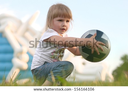 Girl catching ball in park
