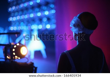 Ballerina on the backstage with a view of stage