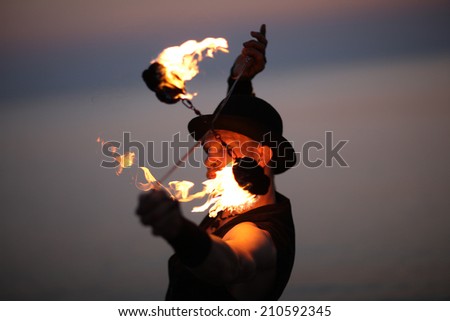 Close up of fire show tricks;face of performer