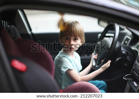 Surprised young driver behind the wheel
