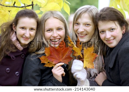 Smiling female friends, autumn