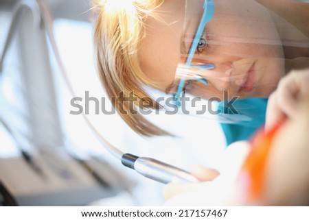 Close up portrait of dentist drilling
