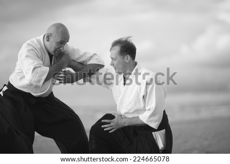 Europeans practicing Japanese martial arts, monochrome