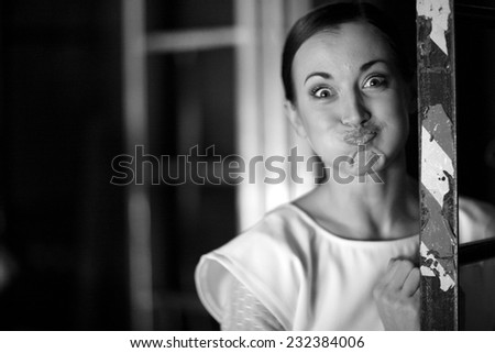 Beautiful actress portrait blowing out cheeks on backstage