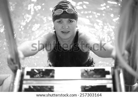 Portrait of a beautiful female swimmer in the pool