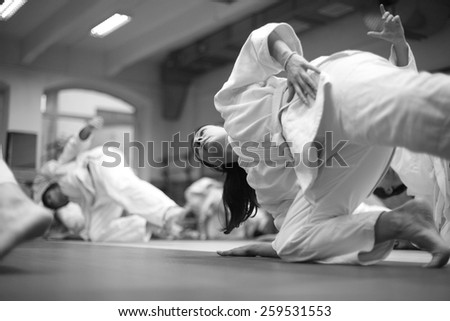 Woman keeping balance at martial arts training