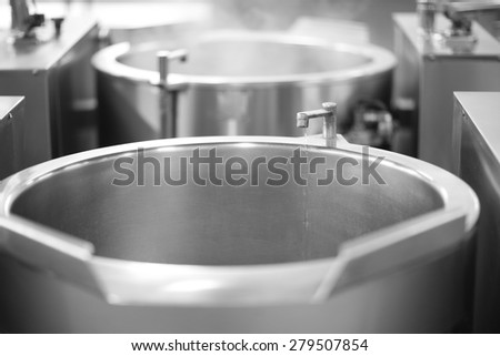 Large stainless steel sink with a small water tap