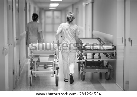 Health care worker\'s transporting emergency beds