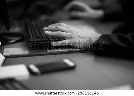 Hands of an office worker typing