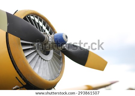 Closeup view of an yellow aircraft propeller