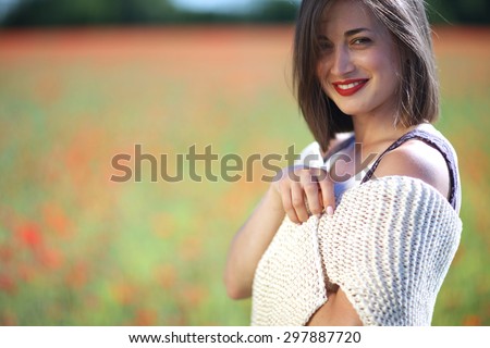 Closeup portrait of a beautiful woman flirting with her eyes