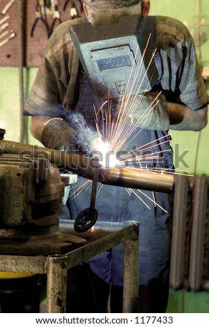 sparks light fly when the welder strikes an arch