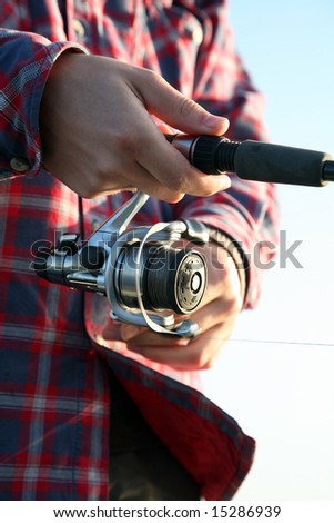 Man in flannel shirt fishing