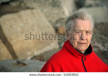 Old woman portrait with red jacket