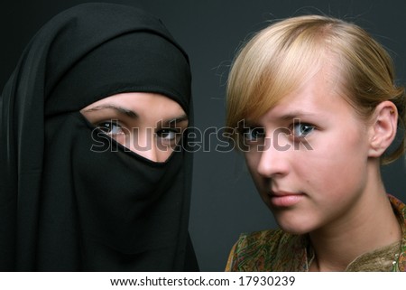 two girls portrait, muslim and christian