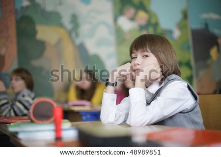 thoughtful young boy sitting on exam