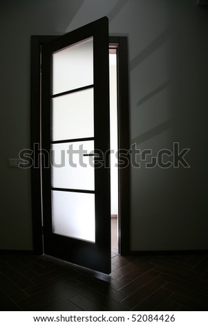 Muffled light from the open door