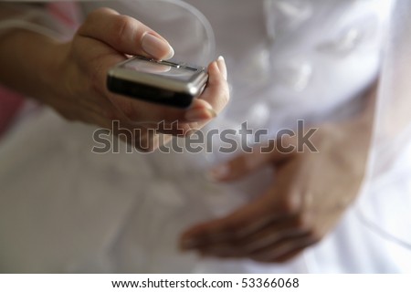 Fiancee with mobile telephone in hands