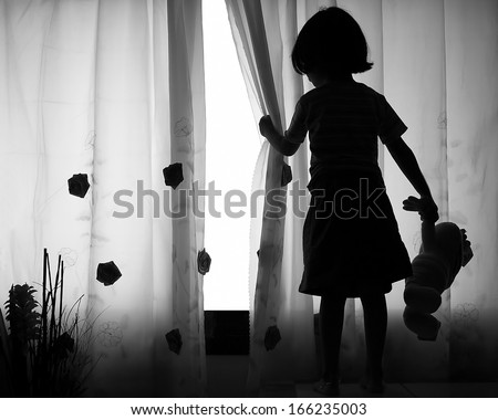 Girl with teddy bear in hand waiting for a friend Girl with teddy bear in hand waiting for a friend