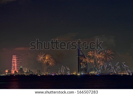 DUBAI, UAE - JANUARY 1: New year celebration with fireworks in Burj Al Arab and Burj Khalifa on January 1,2013 in Dubai, UAE