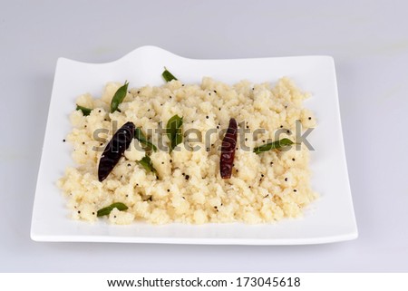 Upma or Uppuma is a common South Indian breakfast dish, cooked as a thick porridge from dry roasted semolina. seasonings of vegetables are often added during the cooking