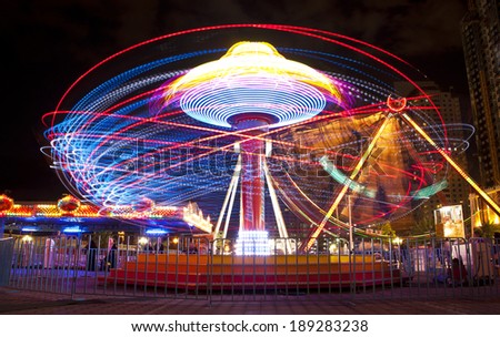 A long exposure of a carnival ride.