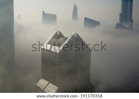 DUBAI, UAE - MAR 6: Dubai Skyline in Sheikh Zayed Road and Downtown is covered by early morning fog on March,6 2014 in Dubai, UAE
