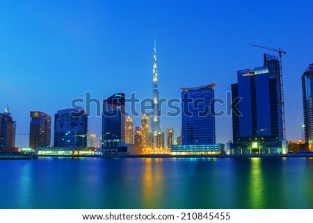 DUBAI, UAE - AUG 1: Creek side view of Dubai skyline in Business bay area in the evening August 1,2014 in Dubai, UAE