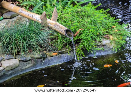 Bamboo fountain catches dripping water in the garden
