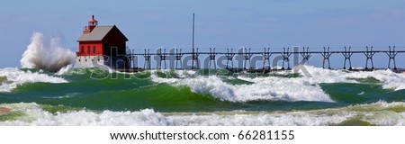 Lake Michigan showing all her fury with waves pounding against the beach in Grand Haven Michigan during a wind storm.