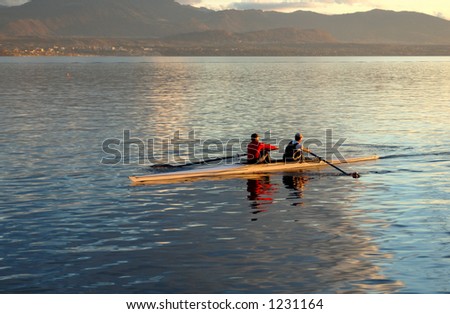 Two oarsmen, practising at St Prex, on Lac LÃ©man (Lake Geneva) in the evening.