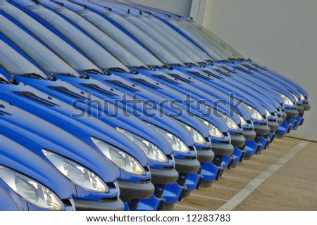 A line of cars parked side by side