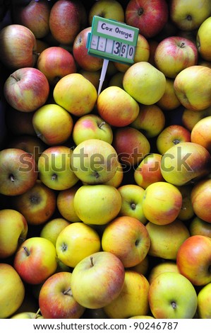 Cox\'s Orange Pippin apples for sale on a market stall, with the price tag