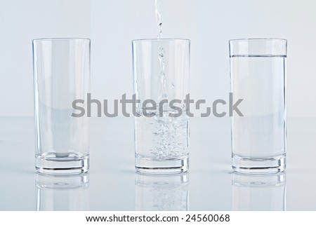 Set of three glass of water over a light blue background, one empty, one full and one with stream of water.