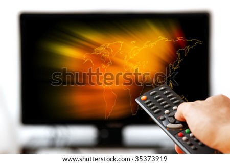 TV LCD set displaying glowing world map. Remote control in man's hand. Isolated over a white background.