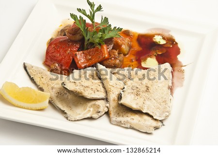 Cooked fish fillet with vegetables side dish