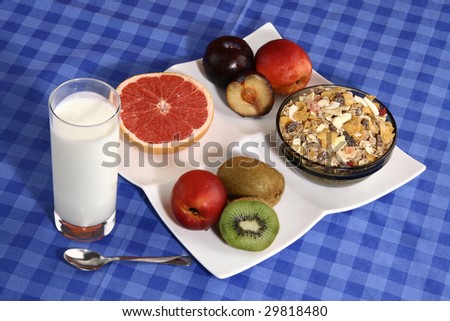 Glass of yogurt with fresh fruits and cereals