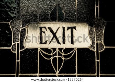 Ornate stained glass exit sign